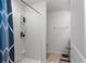Modern bathroom with a tiled shower and convenient shelving at 588 Olive Conch St, Ruskin, FL 33570