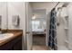 Bathroom featuring a shower, vanity, and stylish fixtures at 588 Olive Conch St, Ruskin, FL 33570