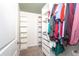 Walk-in closet with shelving and rods providing organized storage solutions at 588 Olive Conch St, Ruskin, FL 33570