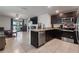 Open concept kitchen with stainless steel appliances and seamless flow to the living area at 588 Olive Conch St, Ruskin, FL 33570