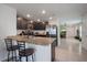 Stylish kitchen features granite counters, stainless steel appliances, and bar stool seating at 588 Olive Conch St, Ruskin, FL 33570