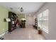 Open-concept living room with tile floors and neutral walls with plenty of natural light at 588 Olive Conch St, Ruskin, FL 33570