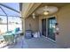 Covered patio featuring outdoor seating and a ceiling fan for comfortable outdoor living and relaxation at 588 Olive Conch St, Ruskin, FL 33570