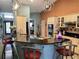 Modern kitchen with a large island, granite countertops, bar seating, and stainless steel appliances at 5920 30Th S Ct, St Petersburg, FL 33712