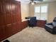 Home office with built in storage, desk and a comfortable leather chair at 5920 30Th S Ct, St Petersburg, FL 33712