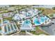Aerial view of the Del Webb community clubhouse, pool, gardens, and recreation areas at 5981 Shorebird Br, Land O Lakes, FL 34638