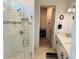 Elegant bathroom with a glass shower, subway tile, and double sink vanity with black hardware at 5981 Shorebird Br, Land O Lakes, FL 34638
