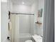Bright bathroom with white tile shower-tub and modern fixtures at 5981 Shorebird Br, Land O Lakes, FL 34638