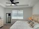 Cozy bedroom with soft lighting and light wood furniture at 5981 Shorebird Br, Land O Lakes, FL 34638