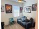 Comfortable bonus room with a ceiling fan, sofa and decor at 5981 Shorebird Br, Land O Lakes, FL 34638