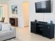Bright living room with flat screen TV and view of dining area at 5981 Shorebird Br, Land O Lakes, FL 34638