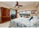 Bright bedroom with serene views, a large wardrobe, and a cozy chair at 7040 Key Haven Rd # 601, Seminole, FL 33777