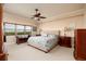 Cozy bedroom with scenic views, featuring a neutral color scheme and plenty of natural light at 7040 Key Haven Rd # 601, Seminole, FL 33777