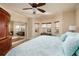 Well-lit bedroom featuring a large bed, bay windows, and mirrored closet doors at 7040 Key Haven Rd # 601, Seminole, FL 33777