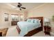 Bright bedroom with a large bed, bay windows, and a ceiling fan for added comfort at 7040 Key Haven Rd # 601, Seminole, FL 33777