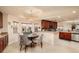 Cozy dining area with views of the kitchen, featuring a modern light fixture and neutral decor at 7040 Key Haven Rd # 601, Seminole, FL 33777
