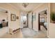 Condo foyer featuring tile flooring, high ceilings, and views into other rooms at 7040 Key Haven Rd # 601, Seminole, FL 33777