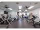 Community gym with treadmills, weight machines, ceiling fans, and wall-mounted mirrors at 7040 Key Haven Rd # 601, Seminole, FL 33777