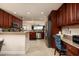 Well-equipped kitchen with stainless steel appliances, granite countertops, and ample cabinet space at 7040 Key Haven Rd # 601, Seminole, FL 33777