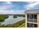 Condo lanai view offers natural views of surrounding landscape and waterways from a screened in porch at 7040 Key Haven Rd # 601, Seminole, FL 33777