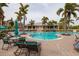 Community pool with ample seating, lush landscaping, and a relaxing atmosphere at 7040 Key Haven Rd # 601, Seminole, FL 33777