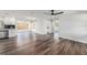 Open floorplan with a kitchen featuring stainless appliances and white cabinets at 7327 Jasmine Blvd, Port Richey, FL 34668