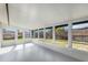 Bright sunroom with large windows offering backyard views and plenty of natural light at 7327 Jasmine Blvd, Port Richey, FL 34668