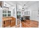 Inviting dining space featuring a breakfast nook, wood flooring, and modern lighting fixtures, creating a cozy atmosphere at 7414 Mint Julep Dr, Riverview, FL 33578