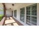 Inviting front porch with brick floors and trim, providing a welcoming and stylish entryway to the home at 7414 Mint Julep Dr, Riverview, FL 33578