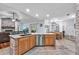 Bright kitchen with a granite-topped island, stainless steel dishwasher, and access to dining and living areas at 7414 Mint Julep Dr, Riverview, FL 33578