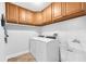 Functional laundry room with plenty of storage and modern washer and dryer at 7414 Mint Julep Dr, Riverview, FL 33578