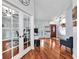Open concept living area with hardwood floors, neutral walls, and abundant natural light perfect for gathering and relaxation at 7414 Mint Julep Dr, Riverview, FL 33578