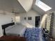 Bright main bedroom featuring skylight, fan, and blue tile flooring at 766 Bay Esplanade, Clearwater Beach, FL 33767