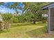 Scenic backyard with mature trees offering ample shade and privacy at 7902 River Ridge Dr, Temple Terrace, FL 33637