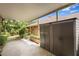 Spacious backyard featuring a covered area, storage unit, and mature landscaping at 7902 River Ridge Dr, Temple Terrace, FL 33637