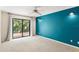 Primary bedroom with carpet floors and sliding glass doors leading to a private deck at 7902 River Ridge Dr, Temple Terrace, FL 33637