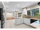 Open-concept kitchen with granite countertops, black appliances, and seamless access to the living area at 7902 River Ridge Dr, Temple Terrace, FL 33637