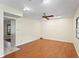 Large open living room featuring hardwood floors, a ceiling fan, recessed lighting, and a large window at 7902 River Ridge Dr, Temple Terrace, FL 33637
