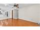Spacious living room with hardwood floors and an open concept design leading to the kitchen at 7902 River Ridge Dr, Temple Terrace, FL 33637