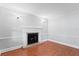 Cozy living room with beautiful hardwood floors and white fireplace at 7902 River Ridge Dr, Temple Terrace, FL 33637