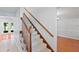 Interior view of the carpeted stairs with wooden banister and trim at 7902 River Ridge Dr, Temple Terrace, FL 33637