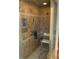 A renovated bathroom with tiled walls, a shower seat, and gold finishings at 819 Satinleaf Ave, Oldsmar, FL 34677