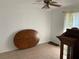 An empty bedroom with neutral walls, a ceiling fan, and a built-in cabinet at 819 Satinleaf Ave, Oldsmar, FL 34677