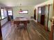 Spacious game room featuring a pool table, updated flooring, and natural light through multiple windows at 819 Satinleaf Ave, Oldsmar, FL 34677