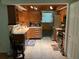 An eat-in kitchen with wood cabinetry, stainless steel appliances, and an adjacent dining area at 819 Satinleaf Ave, Oldsmar, FL 34677
