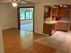Spacious open concept kitchen with hardwood floors flowing into a dining/living space and tile floors in kitchen at 819 Satinleaf Ave, Oldsmar, FL 34677