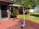 Lush yard with landscaping, beautiful rockwork, and decorative border adds curb appeal to the property at 819 Satinleaf Ave, Oldsmar, FL 34677