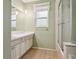 Clean bathroom featuring a tub shower and a modern vanity at 8350 Monarch Cir, Seminole, FL 33772