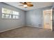 Bedroom with carpet, natural light, and hardwood floors in hallway at 8350 Monarch Cir, Seminole, FL 33772