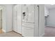 Bright kitchen with stainless steel appliances and white cabinets for ample storage at 8350 Monarch Cir, Seminole, FL 33772